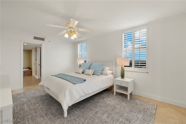 6573 Marissa Loop Unit 2004, Naples, FL 34108 - bedroom featuring baseboards and a ceiling fan