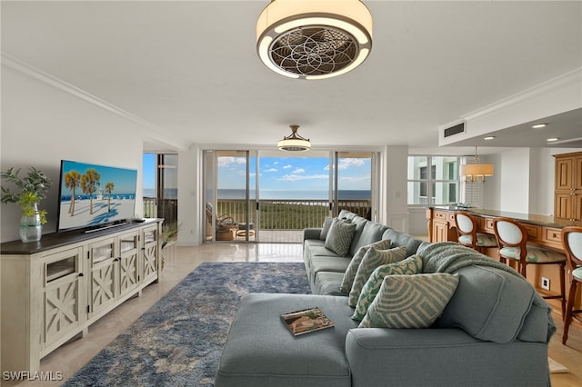 6573 Marissa Loop Unit 2004, Naples, FL 34108 - living room with crown molding and expansive windows