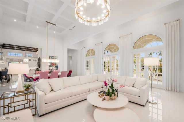 tiled living room with a towering ceiling, a chandelier, beamed ceiling, and coffered ceiling