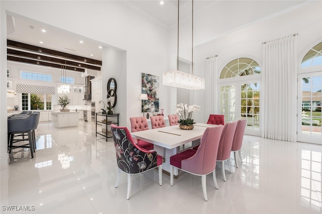 dining space with light tile patterned floors and beamed ceiling