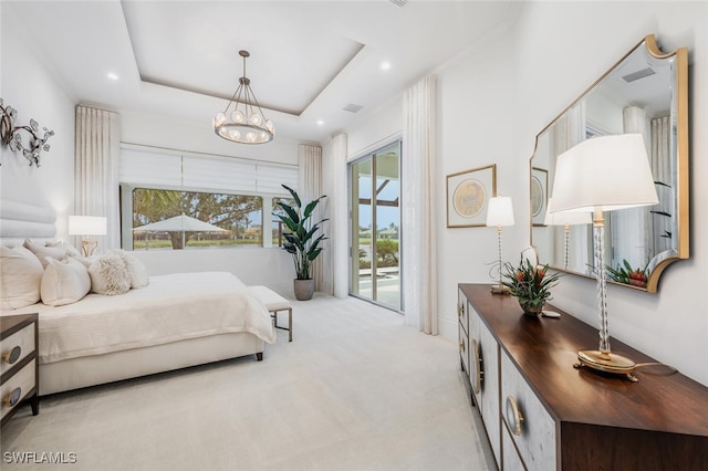 carpeted bedroom with an inviting chandelier, access to exterior, and a raised ceiling