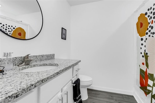 bathroom featuring toilet, a shower with curtain, wood-type flooring, and vanity