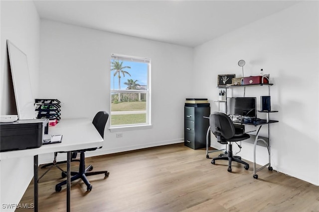 office area with light hardwood / wood-style floors