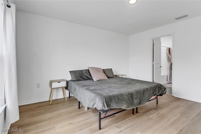 bedroom featuring light wood-type flooring and pool table