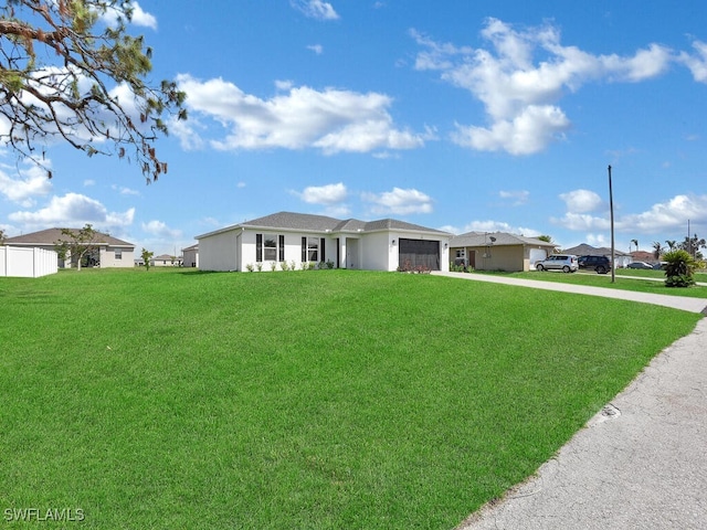 ranch-style home with a garage and a front yard