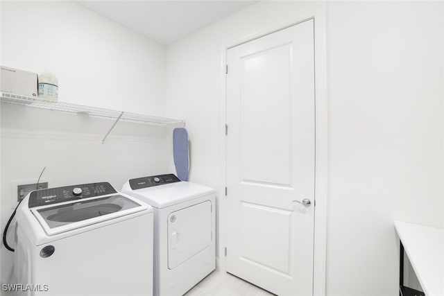 laundry room with washing machine and dryer