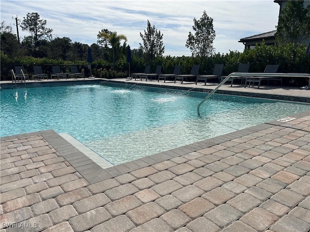 view of swimming pool with a patio area