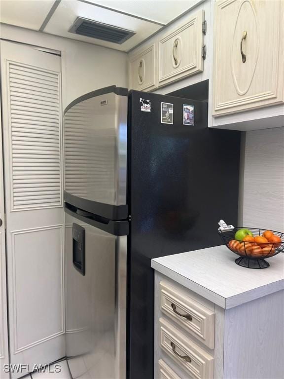 kitchen featuring stainless steel fridge