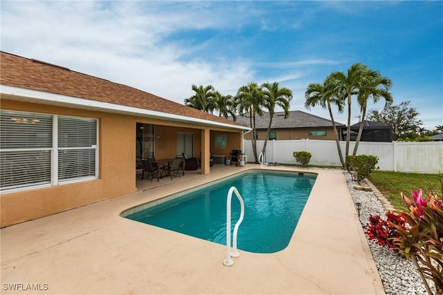 view of swimming pool with a patio area