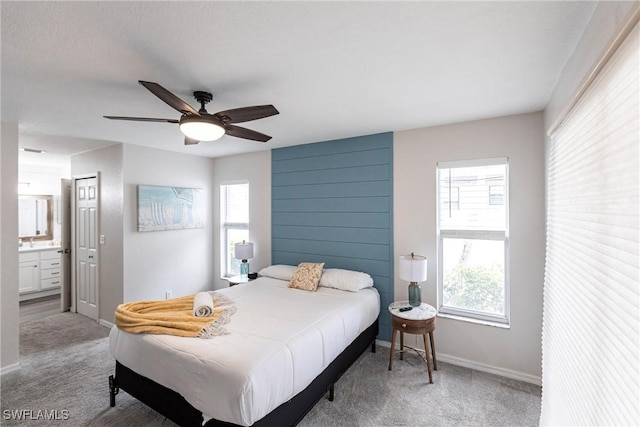 bedroom featuring ceiling fan, carpet, and connected bathroom