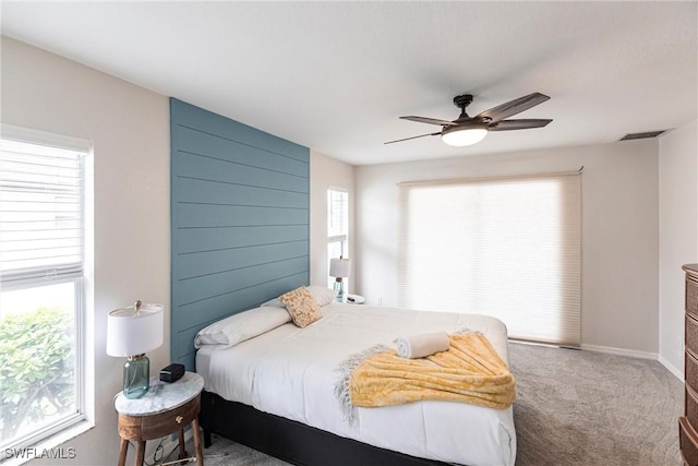 carpeted bedroom featuring ceiling fan