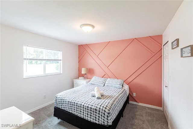 bedroom featuring dark colored carpet