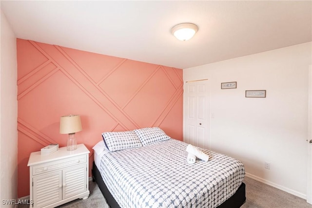 bedroom with a closet and carpet flooring