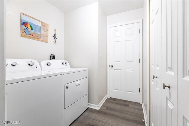 laundry room featuring dark hardwood / wood-style floors and washing machine and clothes dryer