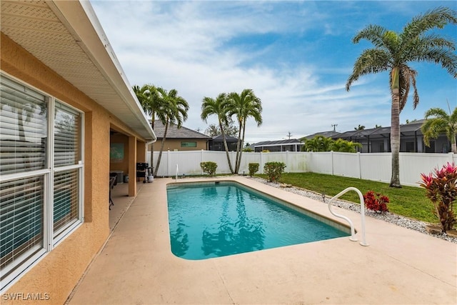 view of swimming pool featuring a patio area