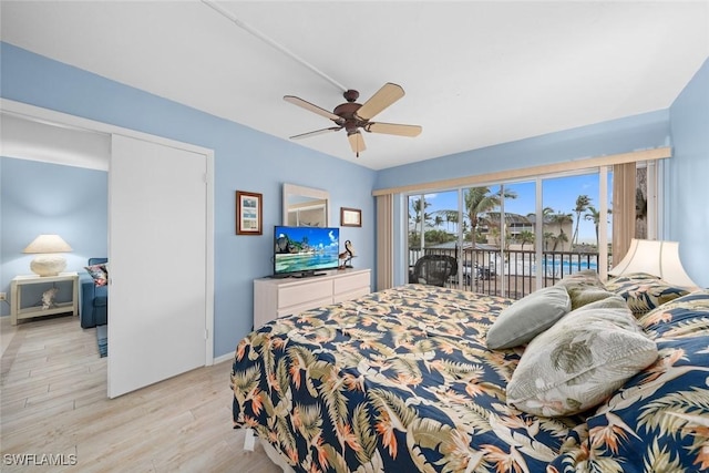 bedroom with ceiling fan, access to outside, light wood finished floors, and baseboards