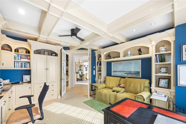 office area featuring ceiling fan with notable chandelier, built in shelves, beam ceiling, and coffered ceiling