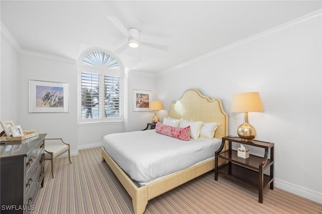 carpeted bedroom featuring ceiling fan and ornamental molding