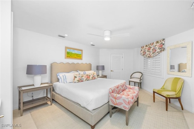 bedroom featuring ceiling fan and a closet