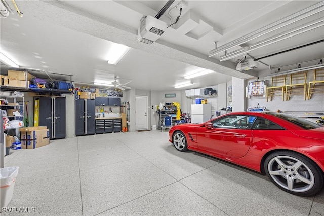 garage with a garage door opener and white refrigerator