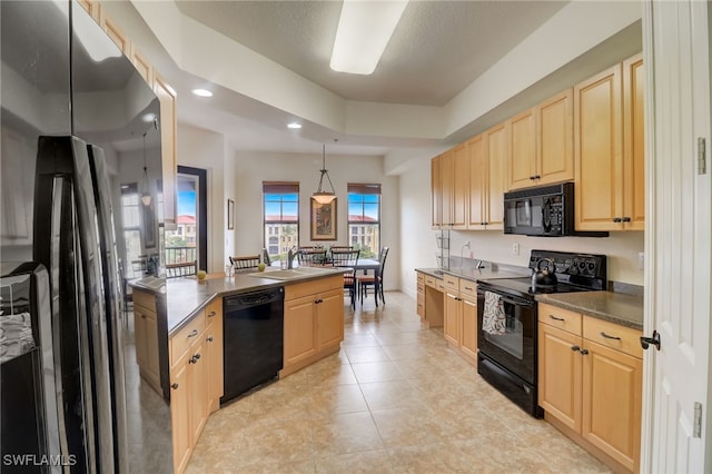 kitchen with light tile patterned floors, black appliances, light brown cabinetry, pendant lighting, and sink