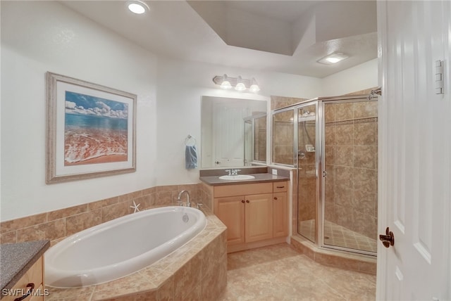 bathroom with vanity, tile patterned flooring, and independent shower and bath