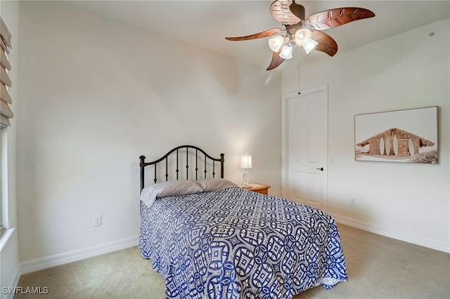 bedroom with ceiling fan and carpet floors