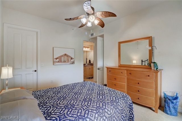 carpeted bedroom featuring ceiling fan and connected bathroom