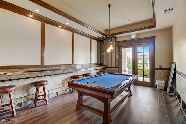 recreation room with dark hardwood / wood-style flooring, french doors, billiards, a tray ceiling, and crown molding