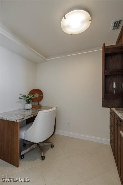 home office with light tile patterned floors