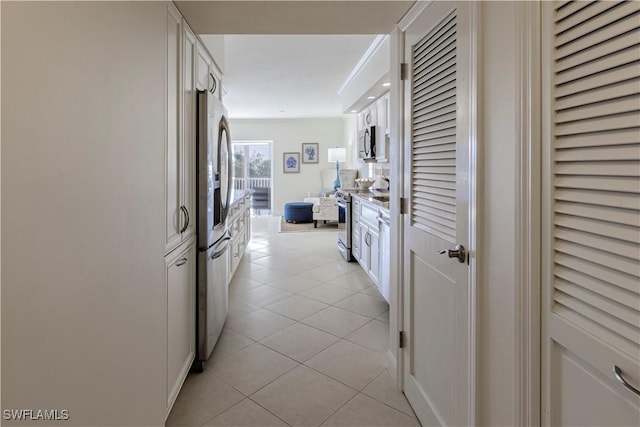 hall with light tile patterned floors