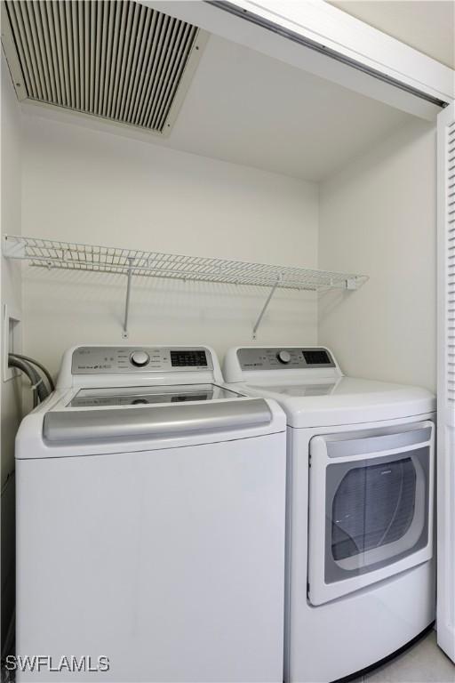 laundry area with independent washer and dryer