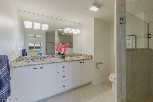 bathroom featuring vanity, an enclosed shower, tile patterned flooring, and toilet