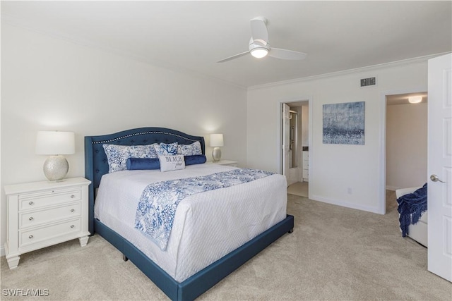 carpeted bedroom with ornamental molding and ceiling fan