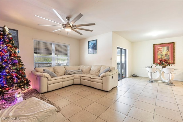 tiled living room featuring ceiling fan and a wealth of natural light