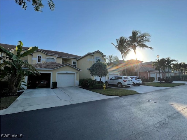 front of property with a garage