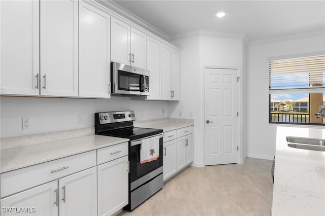 kitchen featuring sink, crown molding, light stone counters, appliances with stainless steel finishes, and white cabinets