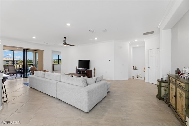 tiled living room with crown molding and ceiling fan