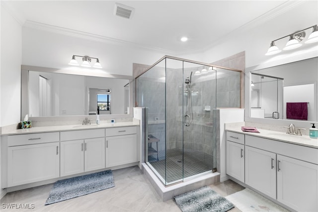 bathroom with ornamental molding, vanity, and walk in shower