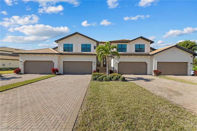 view of front of house featuring a garage and a front yard