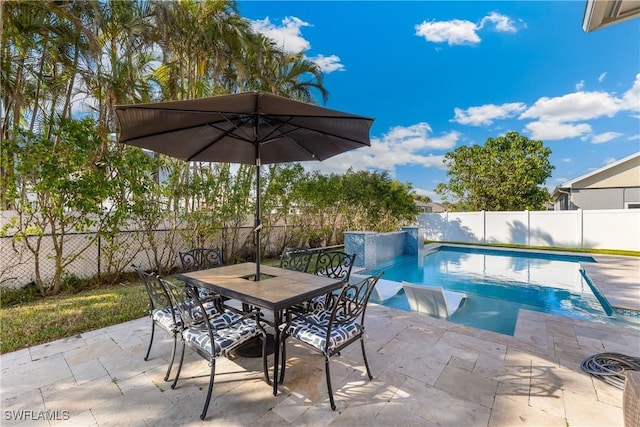 view of pool featuring a patio