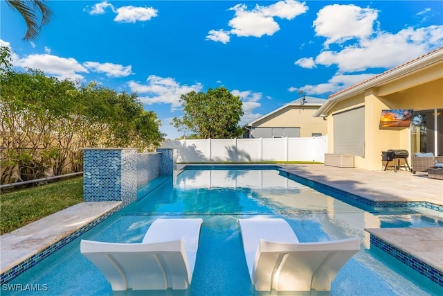 view of swimming pool with a patio