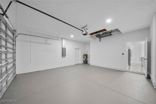 garage with water heater, a garage door opener, electric panel, and stainless steel fridge