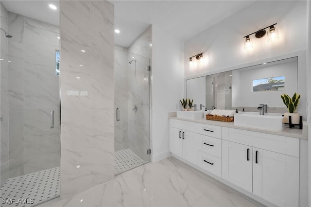 bathroom featuring an enclosed shower and vanity