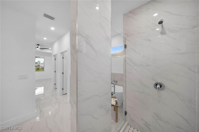 bathroom with a tile shower