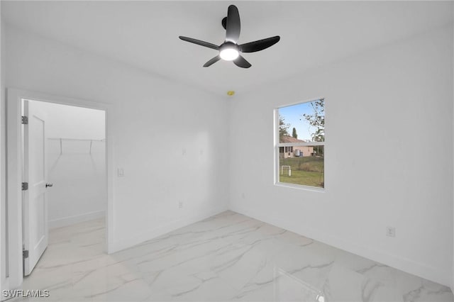 unfurnished room with ceiling fan