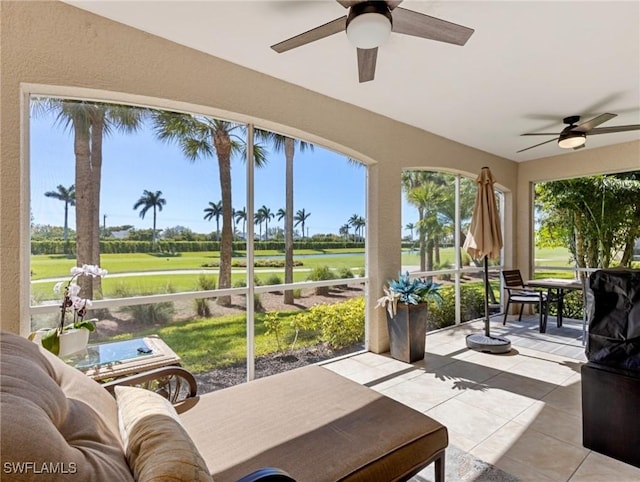11083 Harbour Yacht Ct Unit 102, Fort Myers, FL 33908 - sunroom with ceiling fan, golf course view, and tile patterned floors