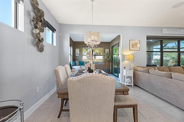 dining area with an inviting chandelier