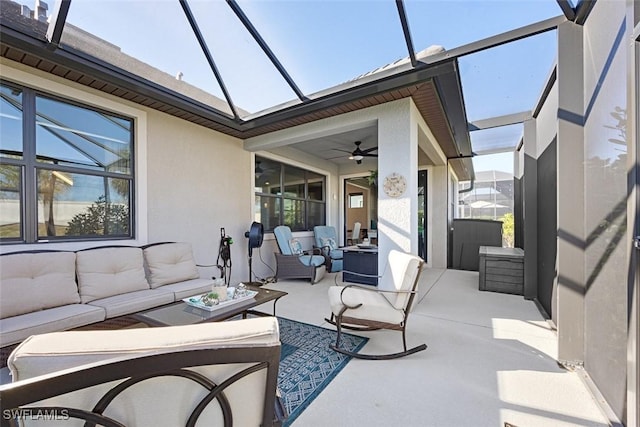 sunroom featuring ceiling fan