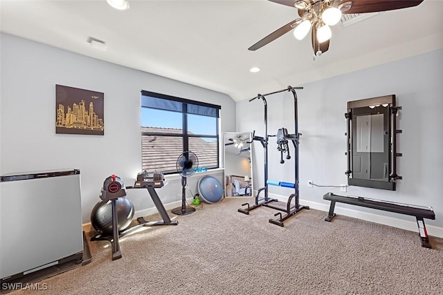 workout room featuring carpet floors, ceiling fan, and vaulted ceiling